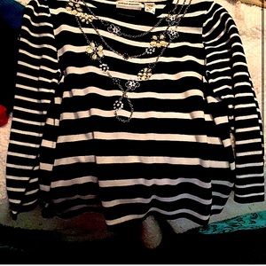 Black and white stripped shirt, with chain connected flowery designs.